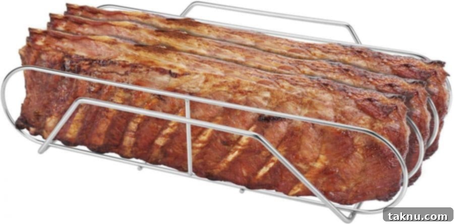 Five racks of ribs in a metal rib rack on a smoker