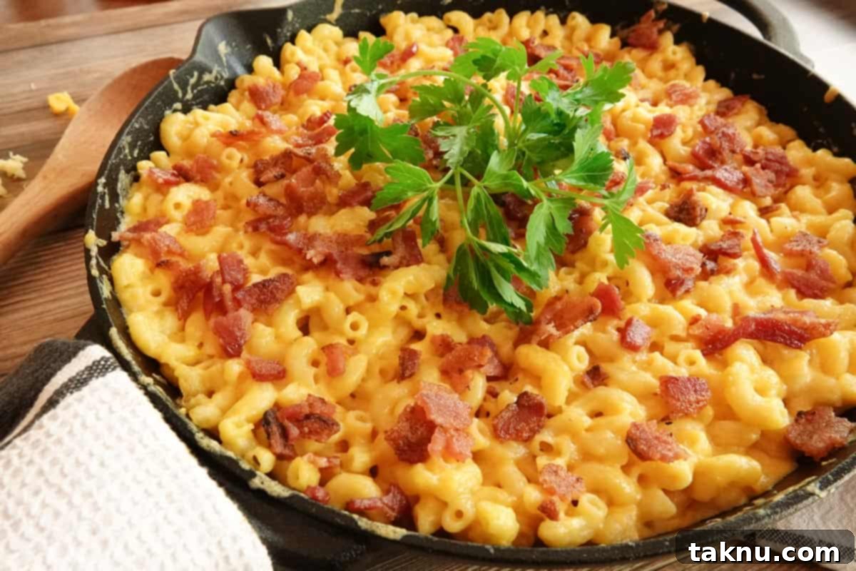 Ultimate Smoked Mac and Cheese 2 smoked mac and cheese in cast iron skillet with parsley garnish