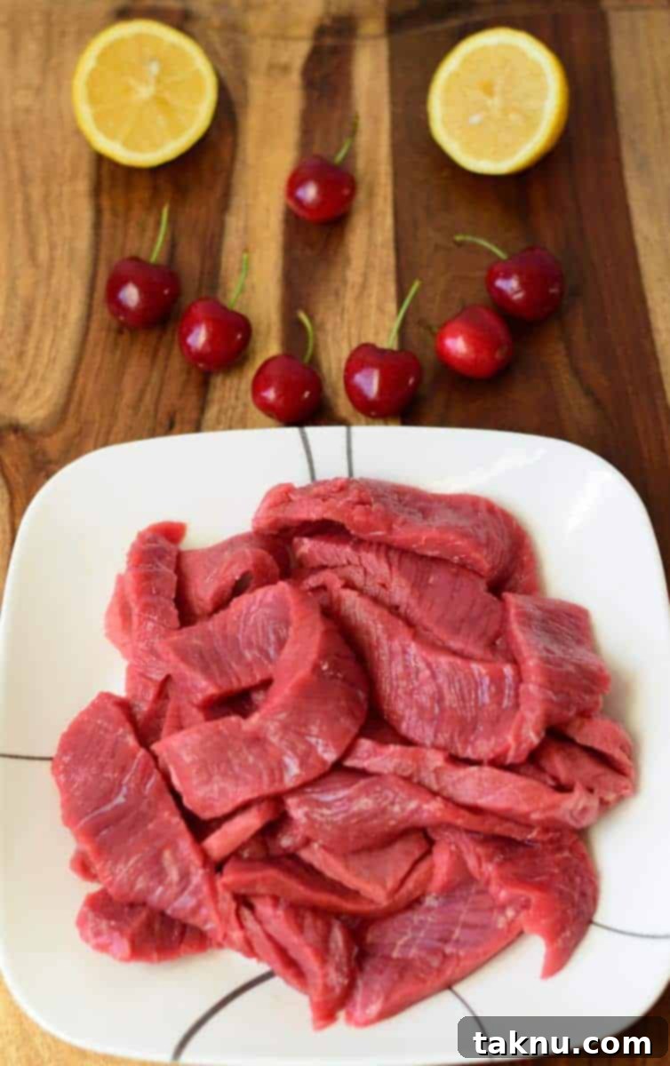 Thinly sliced beef ready for sweet cherry marinade