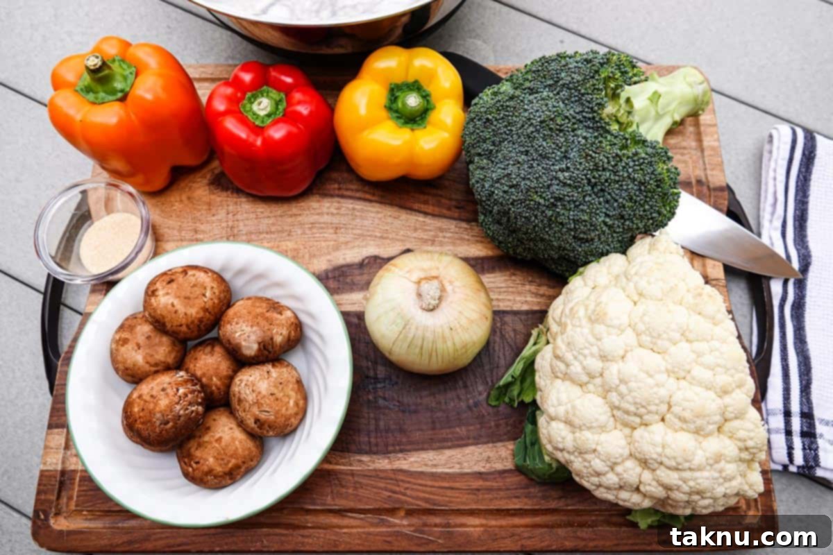 Fresh, colorful vegetables like broccoli, cauliflower, mushrooms, onions, and bell peppers on a cutting board, ready for slicing and smoking.