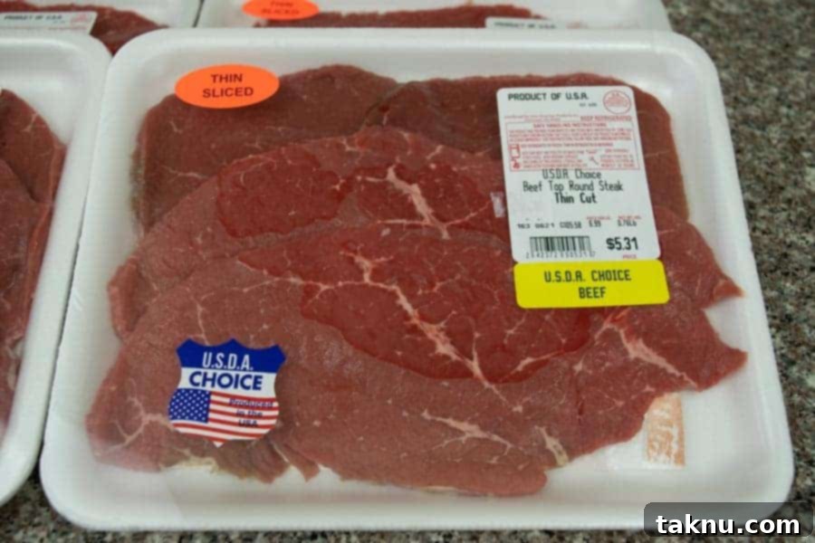 Beef top round sliced thin in package