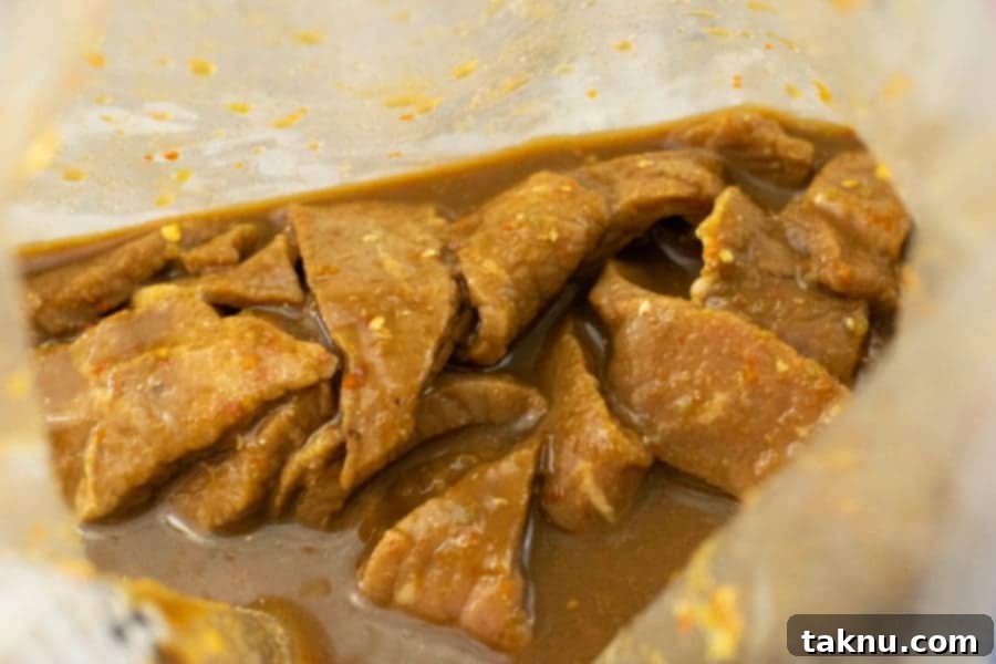 Jerky strips marinating in a ziplock bag