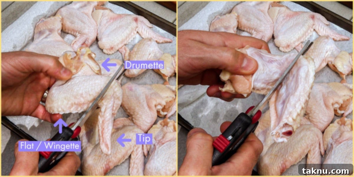 Irresistibly Crispy Smoked Chicken Wings 4 A person's hands using kitchen shears to cut a whole chicken wing into separate drumette and flat pieces on a cutting board.