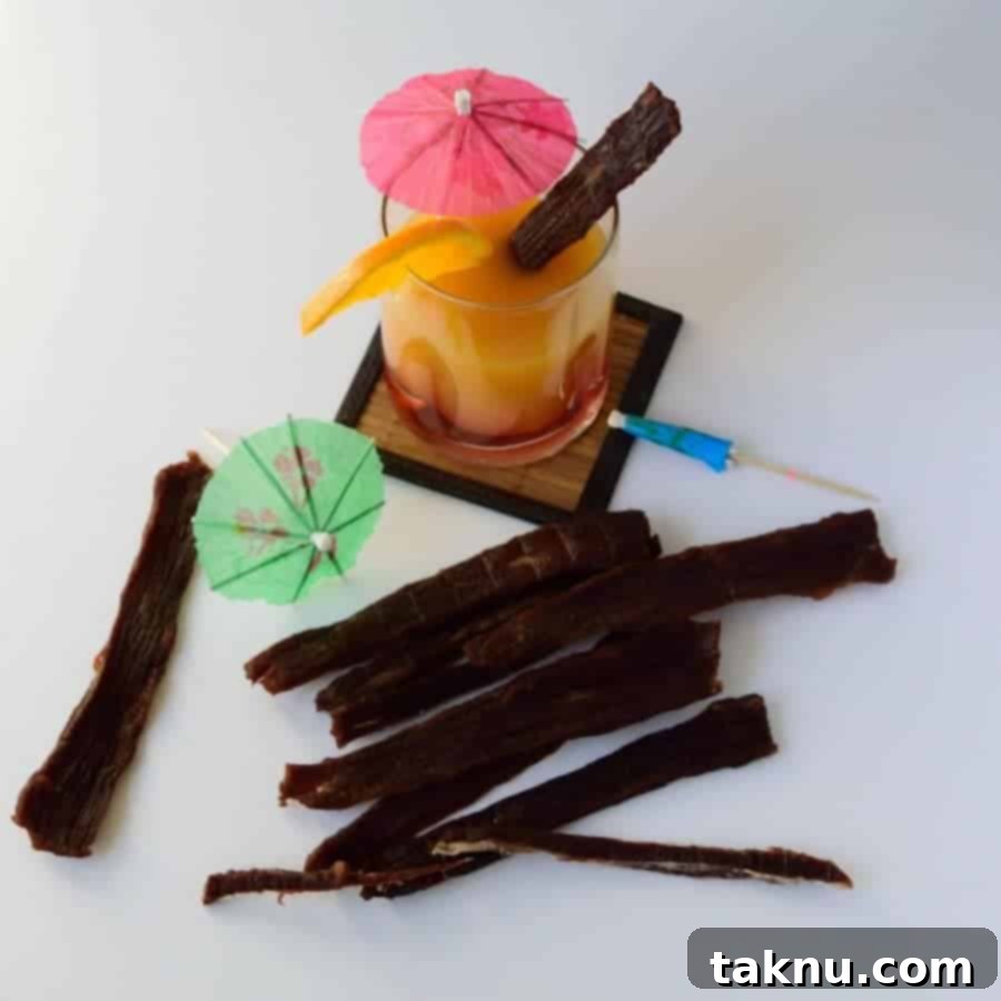 Tropical Mai Tai Beef Jerky 6 Finished Mai Tai Beef Jerky cut into squares, showcasing its unique texture