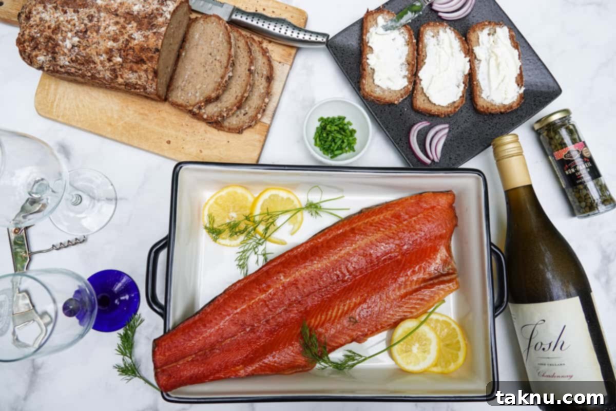 Smoked Trout: Plain & Glazed 2 Smoked trout fillet in dish with bottle of wine, bread, toast, and seasonings