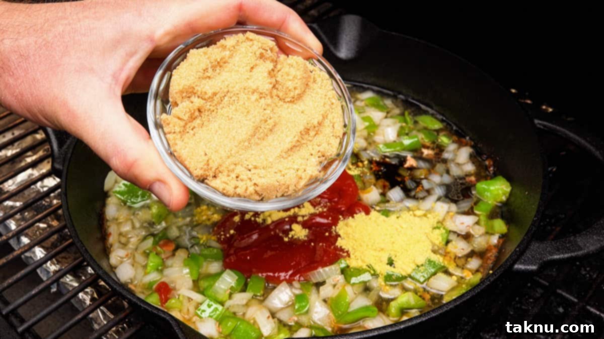 Smoky Bacon Baked Beans 4 Adding rich brown sugar to a cast iron pot filled with sautéed onions, peppers, and beans.