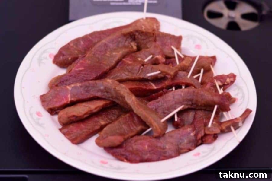 Marinated Beef ready for the smoker, promising a delicious batch of Tennessee Smoked Beef Jerky