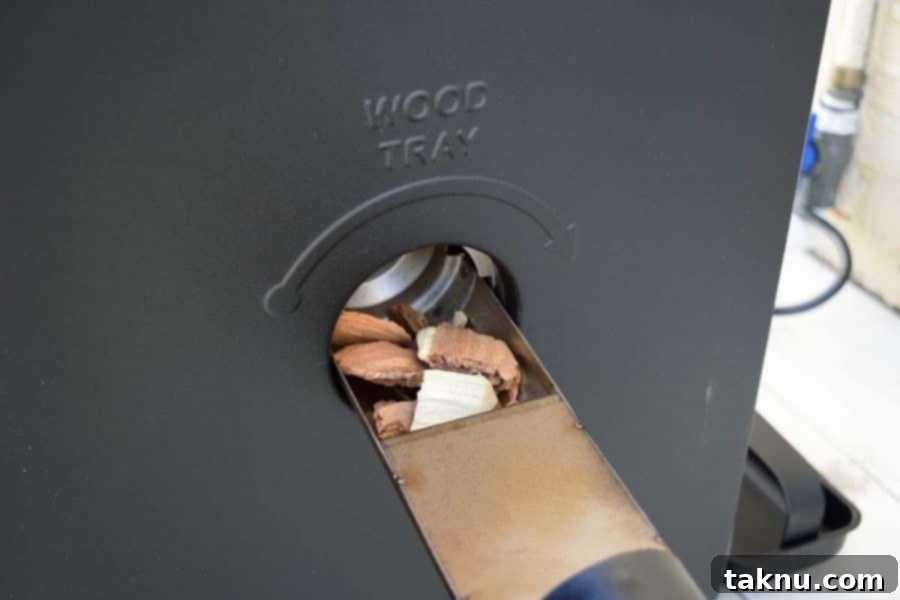 Masterbuilt Smoker wood chip tray filled with wood chips