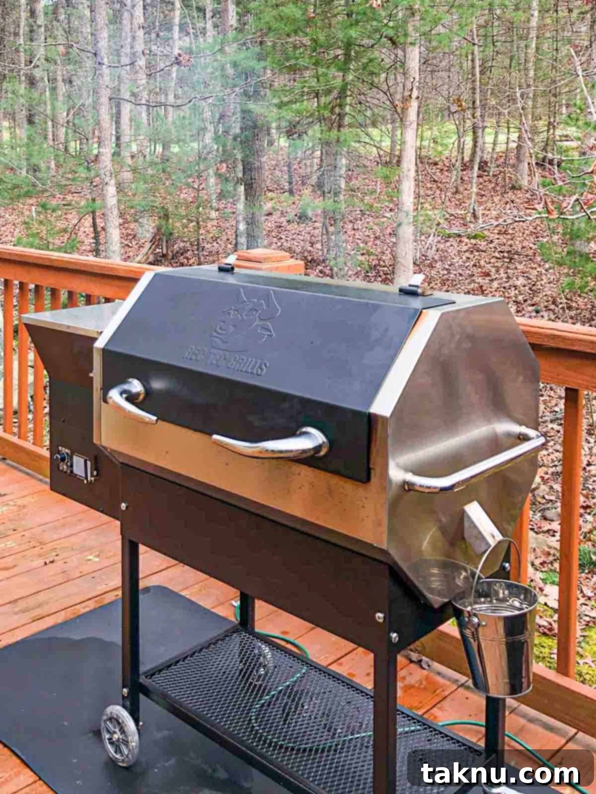 Crafting Smoked Beef Jerky 14 Pellet smoker on a deck, emitting smoke, ready for cooking.