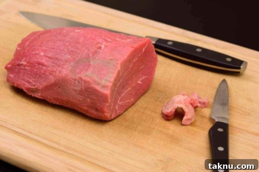 Crafting Smoked Beef Jerky 4 Trimmed beef eye of round roast, showcasing the removal of all visible fat for better jerky quality.